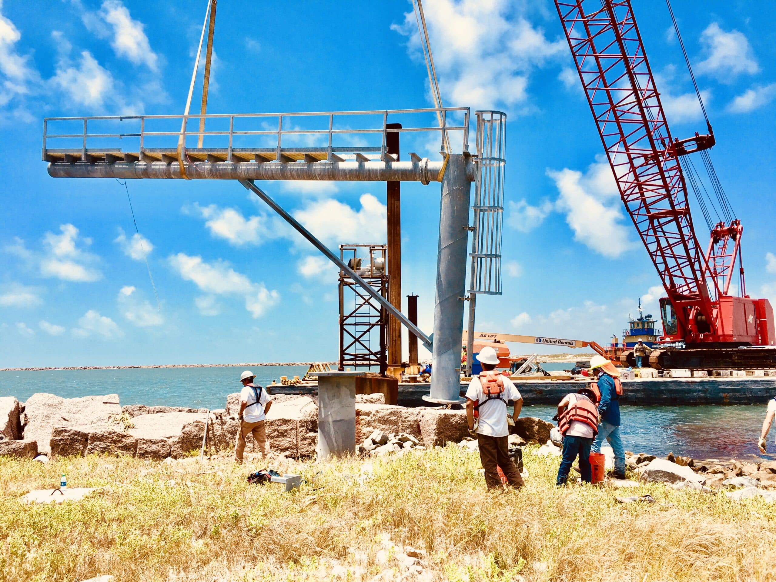 Marine construction project in progress , shipping channel lights being installed | Inland Construction & Engineering, Inc. Panama City, Florida providing construction, general contracting, marine construction, design & engineering, diving services, roofing, & bulding rehab.